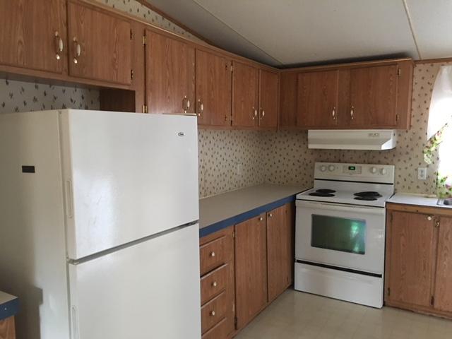1245 McDearmon Road Montvale, VA 24122 - Photo 10 of 12 a white refrigerator freezer sitting inside of a kitchen