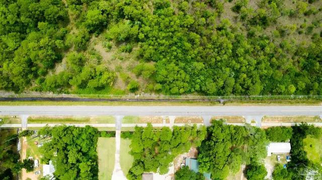 a view of yard with swimming pool