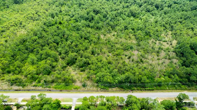a view of backyard with swimming pool and outdoor seating