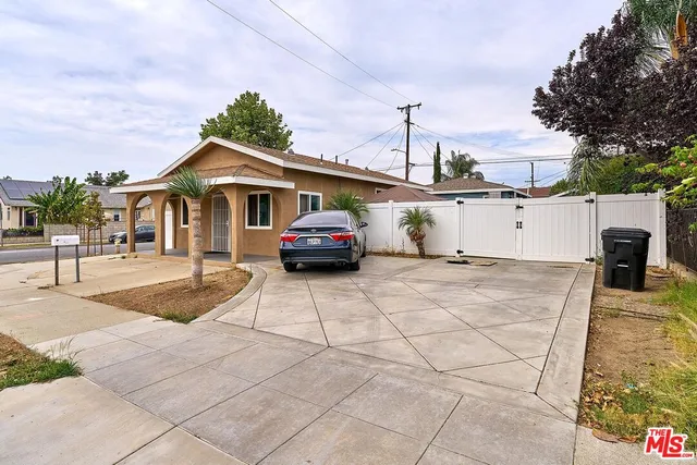 a front view of a house with a yard and a garage