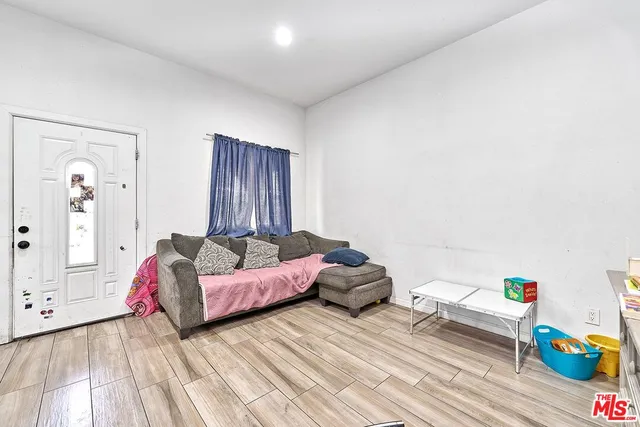 a kitchen that has a lot of furniture and window