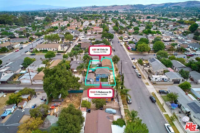 an aerial view of a city with lots of residential buildings