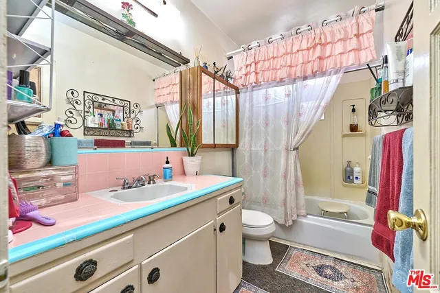 a bedroom with a bed and a closet