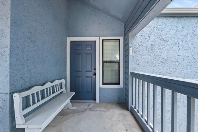 a view of a porch with a large trees