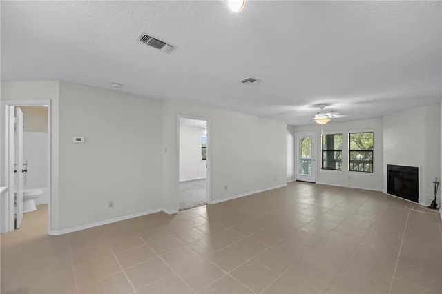 a view of a kitchen with a sink and cabinets