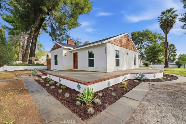 a front view of a house with a yard