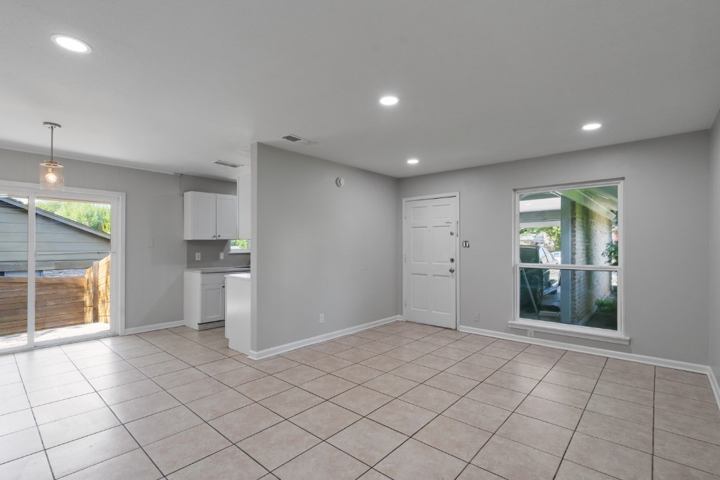 1407 Avebury Circle, Unit B Austin, TX 78753 - Photo 1 of 1 a view of an empty room with a window