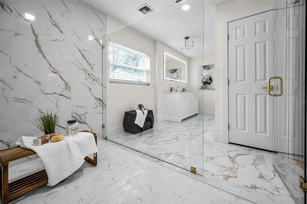 409 Barbara Lane Tampa, FL 33609 - Photo 11 of 51 a bedroom with furniture and a chandelier