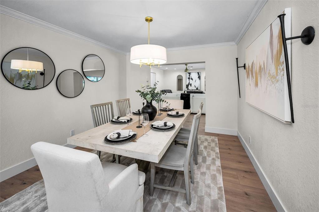409 Barbara Lane Tampa, FL 33609 - Photo 18 of 51 a view of a dining room with furniture chandelier and wooden floor