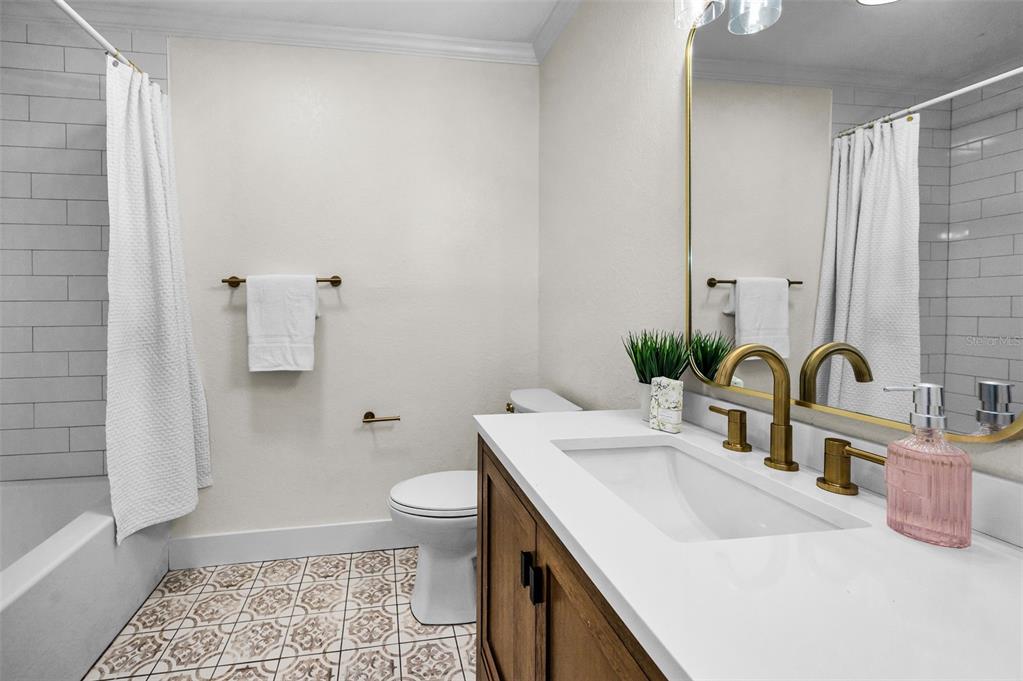 409 Barbara Lane Tampa, FL 33609 - Photo 20 of 51 a bathroom with a sink and a mirror