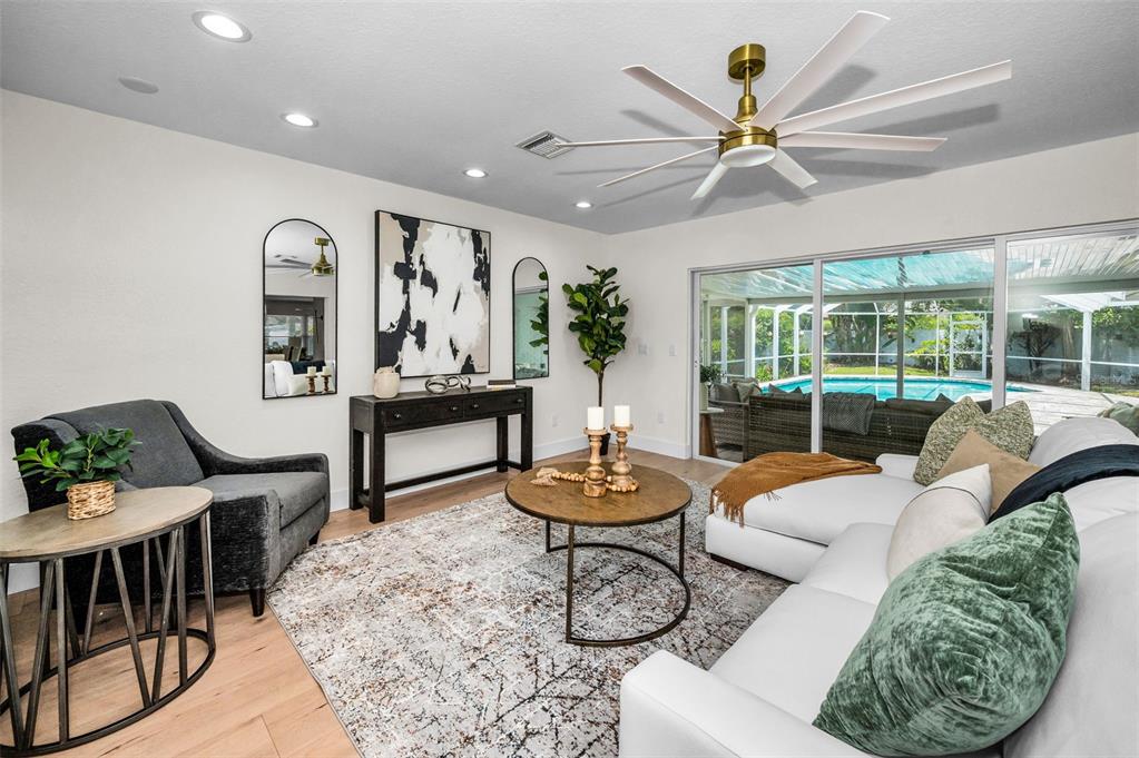 409 Barbara Lane Tampa, FL 33609 - Photo 21 of 51 a living room with furniture and a large window