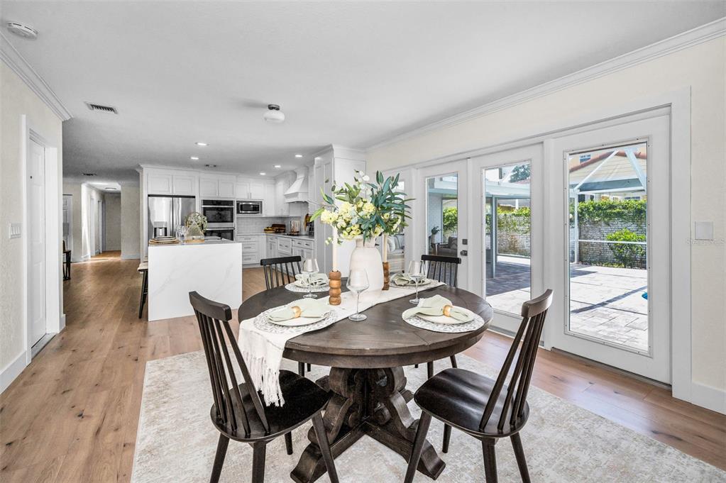 409 Barbara Lane Tampa, FL 33609 - Photo 22 of 51 a view of a dining room with furniture and wooden floor
