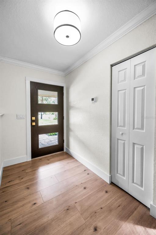 409 Barbara Lane Tampa, FL 33609 - Photo 24 of 51 an empty room with wooden floor and windows