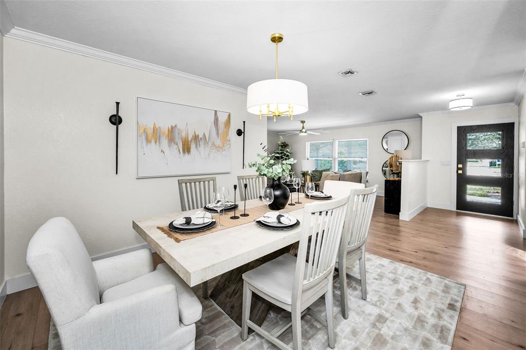 409 Barbara Lane Tampa, FL 33609 - Photo 35 of 51 a view of a dining room with furniture and wooden floor