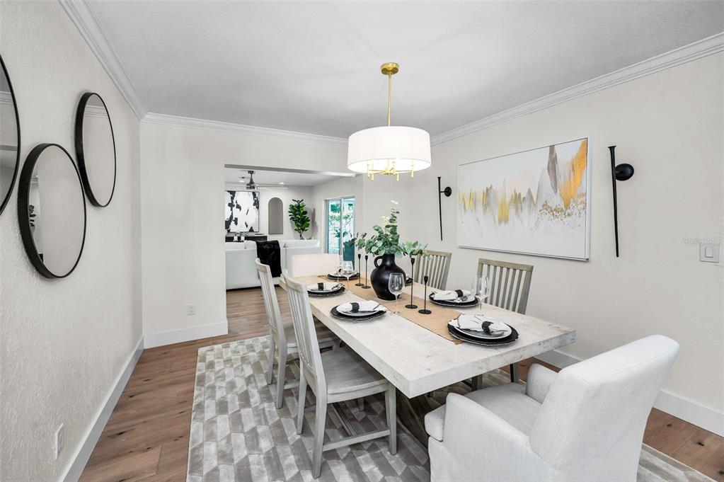 409 Barbara Lane Tampa, FL 33609 - Photo 36 of 51 a view of a dining room with furniture and chandelier
