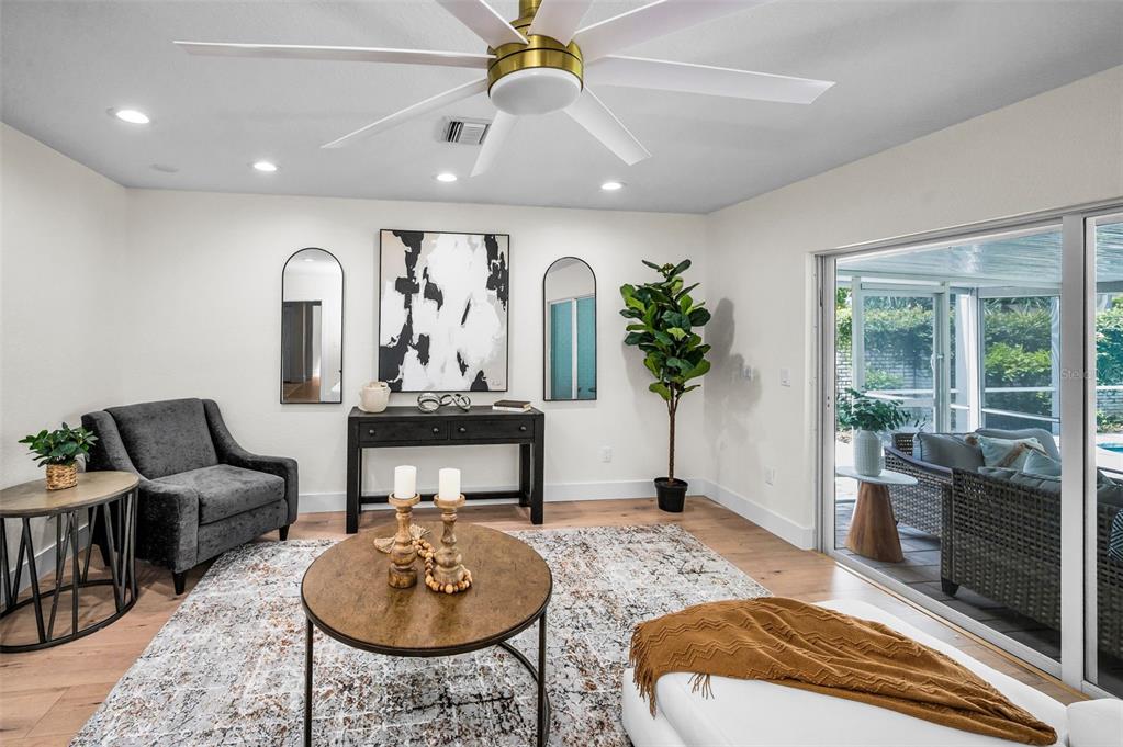 409 Barbara Lane Tampa, FL 33609 - Photo 38 of 51 a living room with furniture a chandelier and a rug