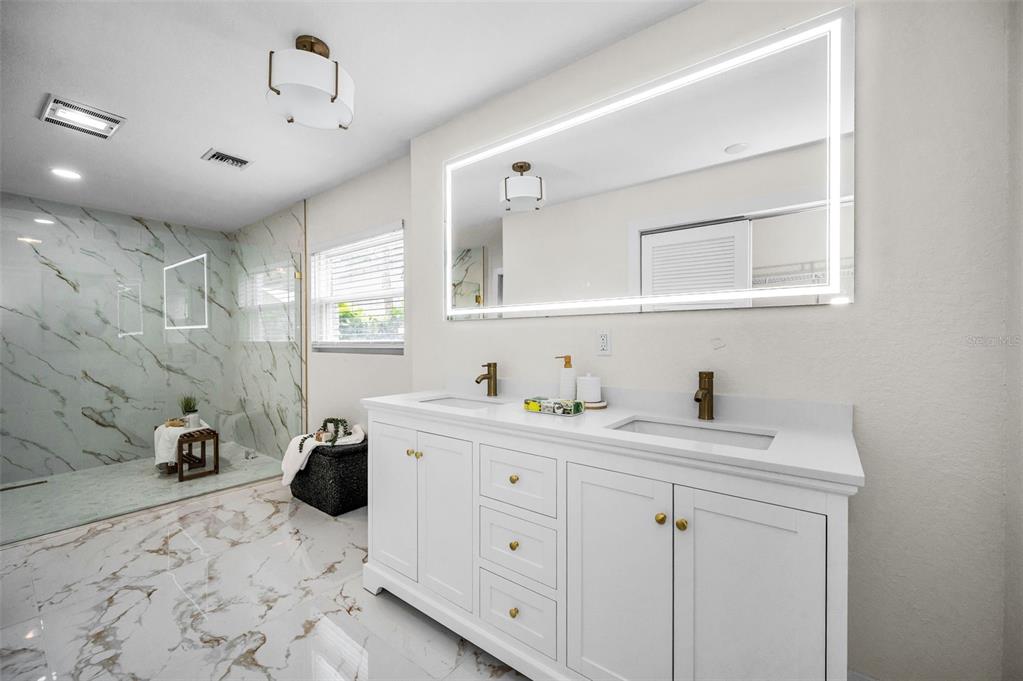 409 Barbara Lane Tampa, FL 33609 - Photo 10 of 51 a view of a center island and bedroom furniture