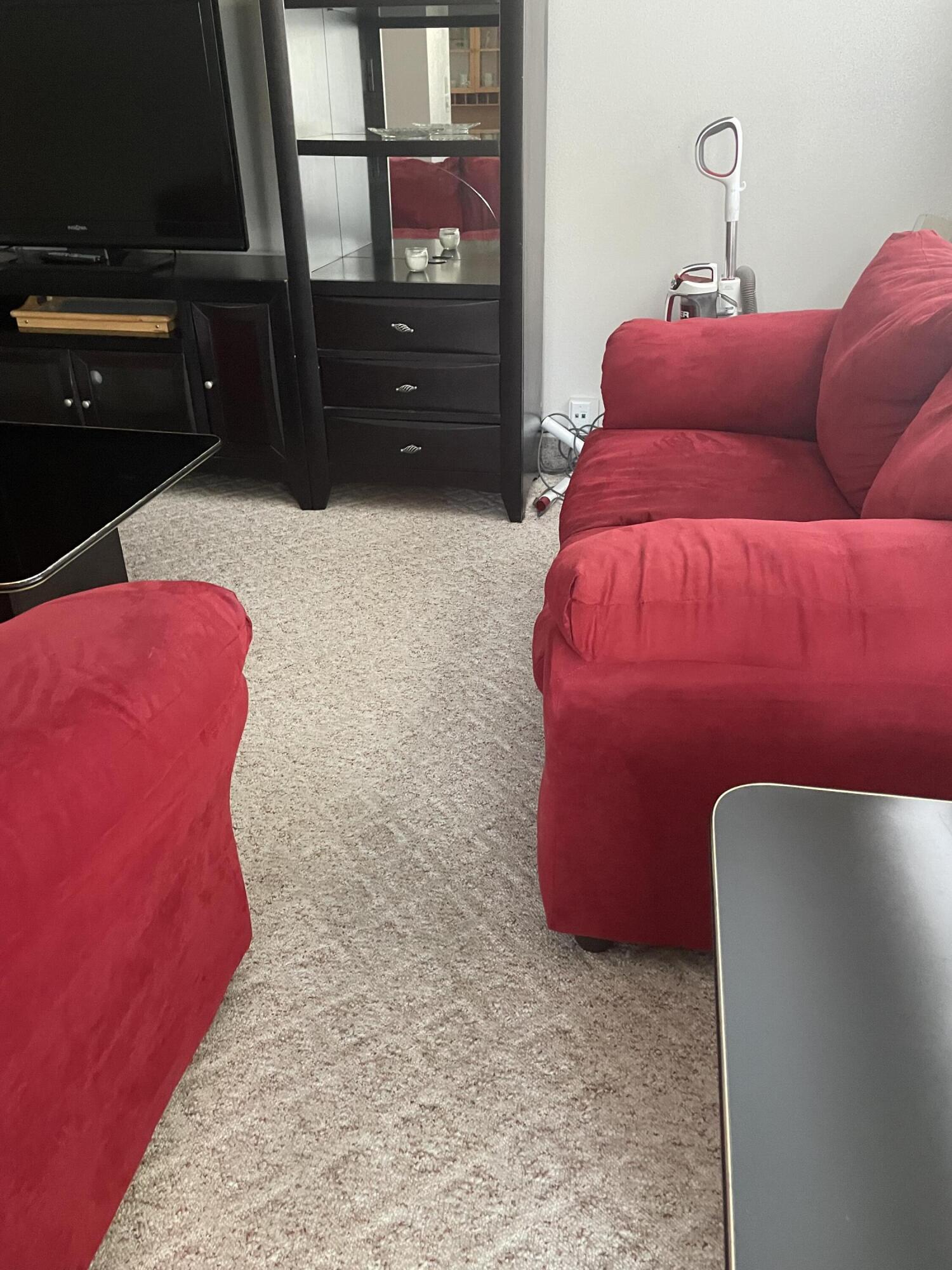 a bed room with a bed and a television