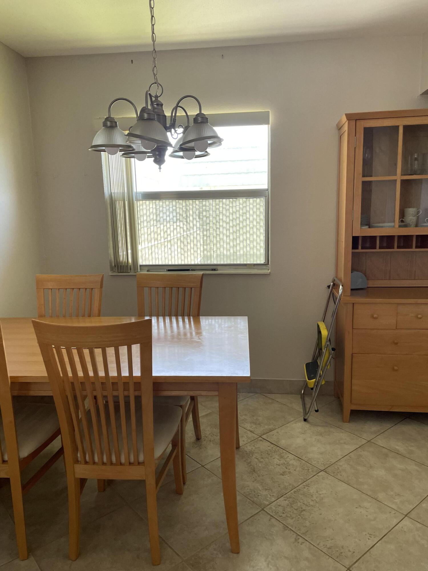 237 Monaco Way Delray Beach, FL 33446 - Photo 2 of 10 a view of a dining room with furniture