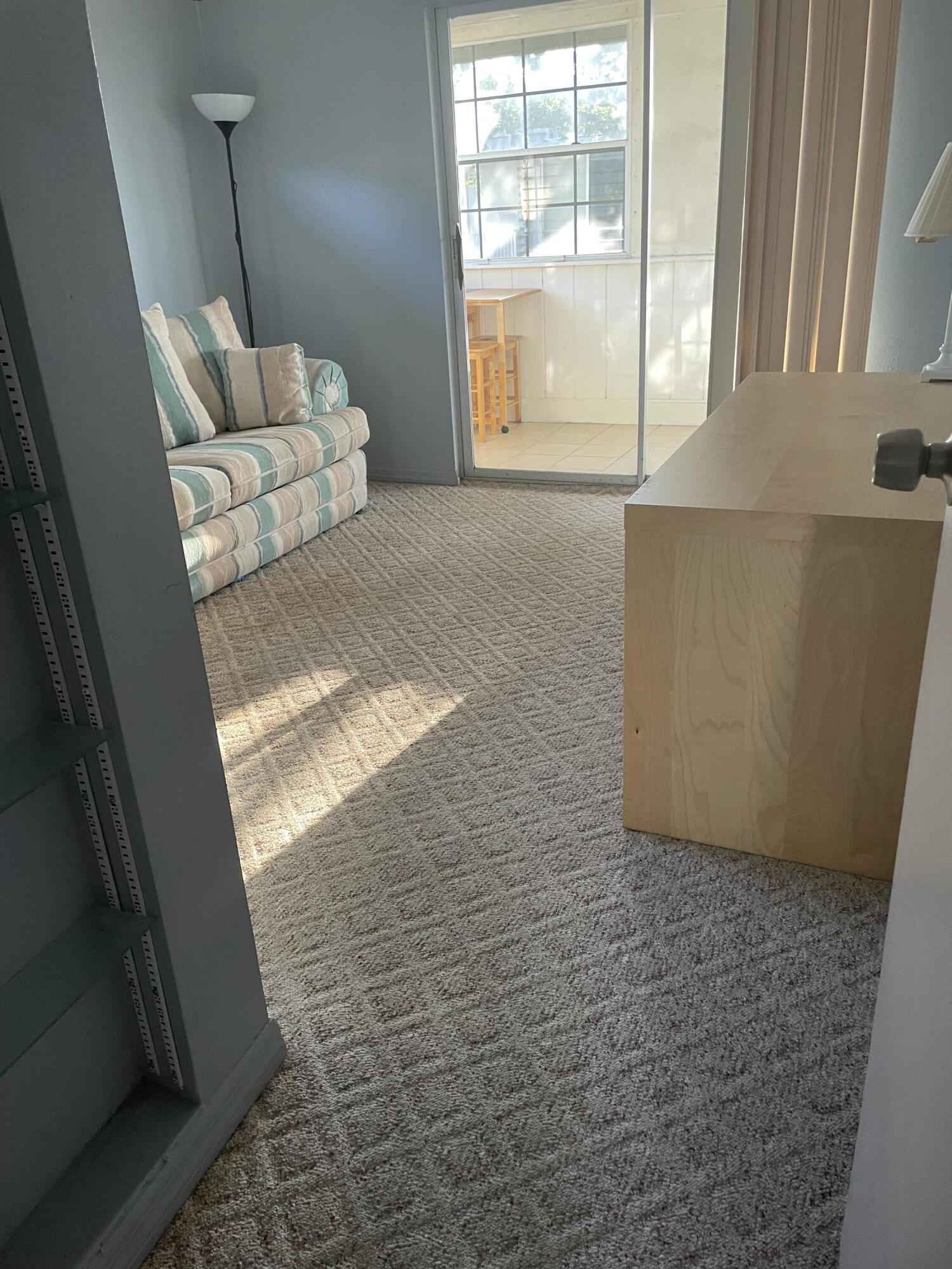 237 Monaco Way Delray Beach, FL 33446 - Photo 5 of 10 a living room with furniture and a window