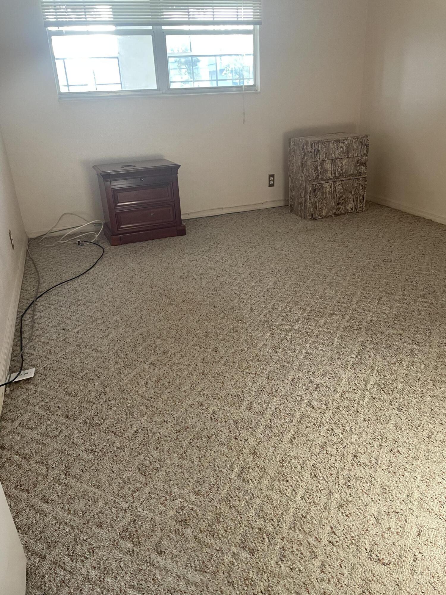 237 Monaco Way Delray Beach, FL 33446 - Photo 6 of 10 a room with a cabinet and a window