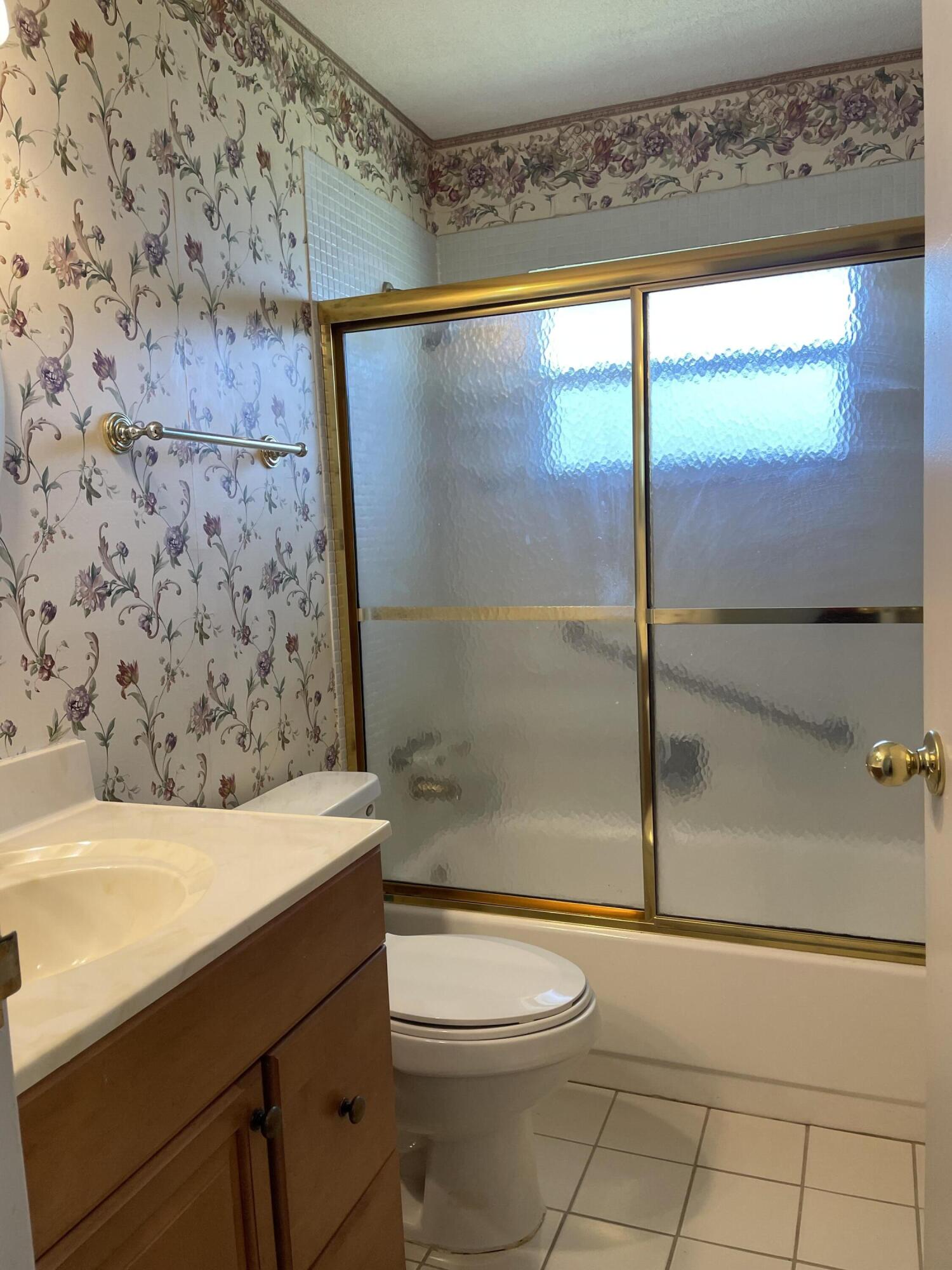 237 Monaco Way Delray Beach, FL 33446 - Photo 10 of 10 a bathroom with a sink a toilet and shower