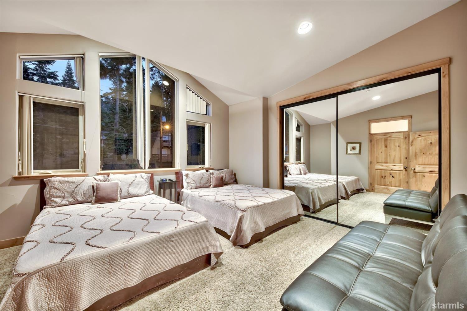 3639 Saddle Road South Lake Tahoe, CA 96150 - Photo 18 of 25 a bedroom with two beds and large window with outer view