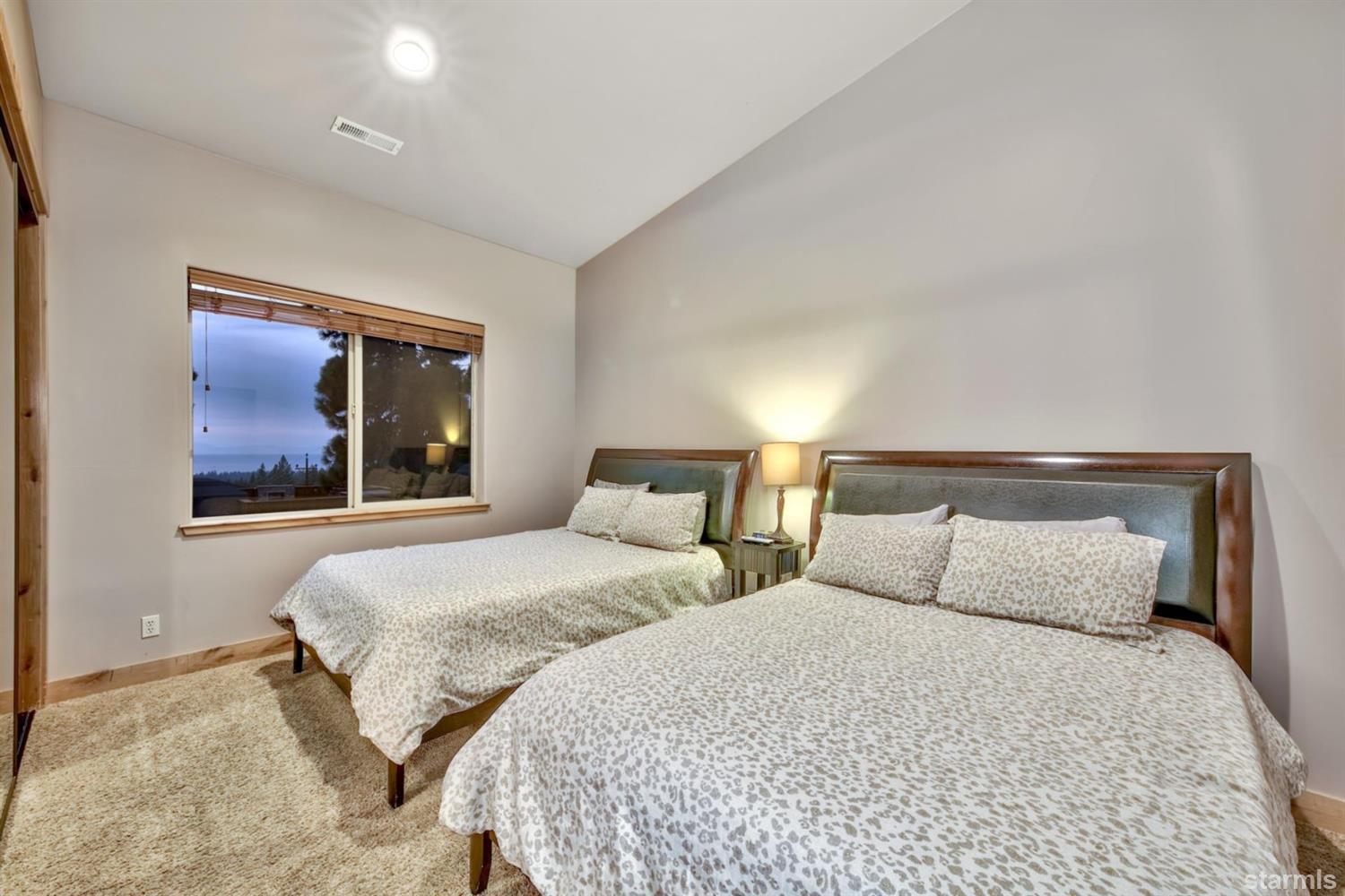 3639 Saddle Road South Lake Tahoe, CA 96150 - Photo 20 of 25 a bedroom with two beds and painting on the wall