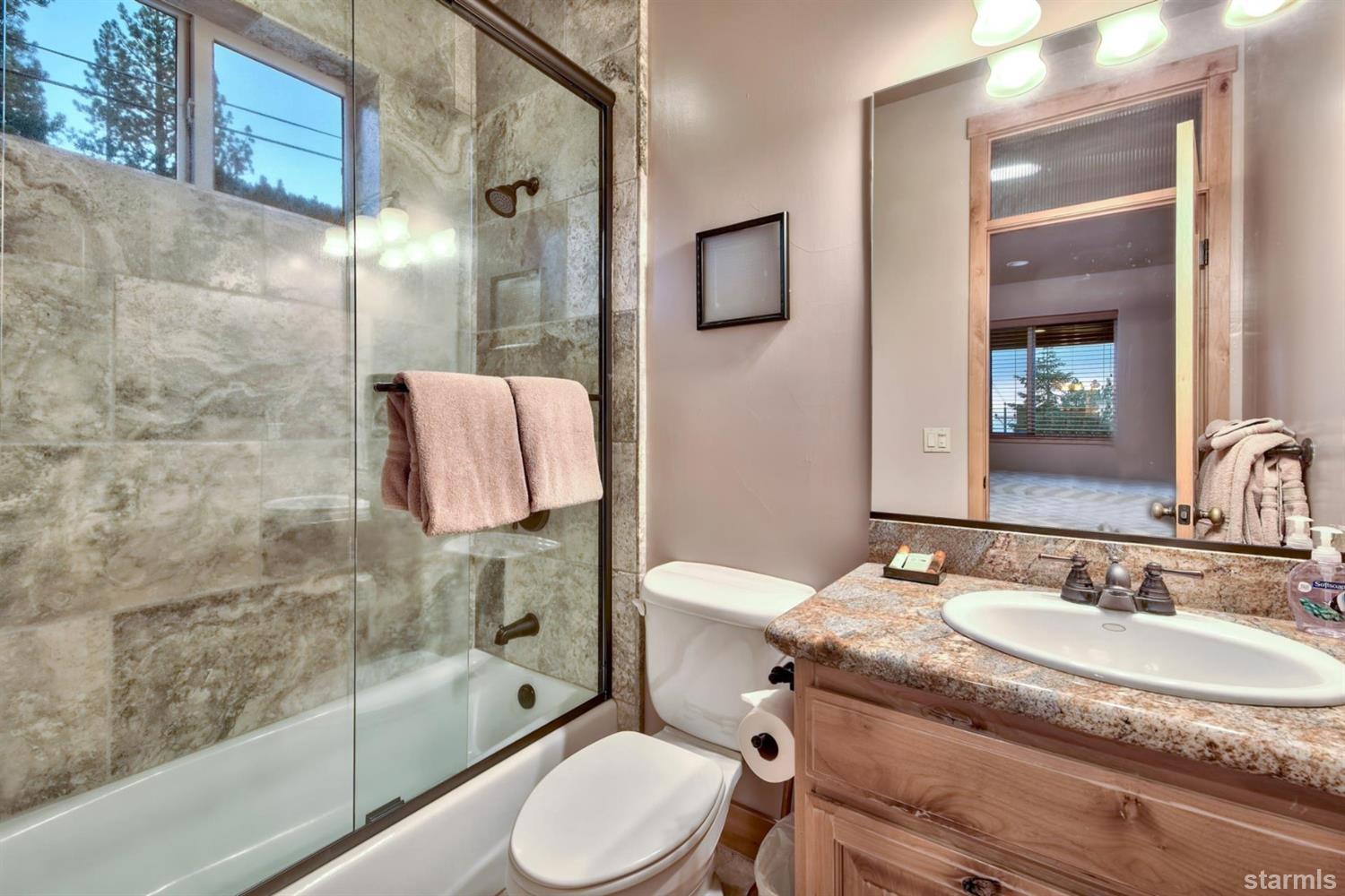 3639 Saddle Road South Lake Tahoe, CA 96150 - Photo 23 of 25 a bathroom with a sink toilet and shower