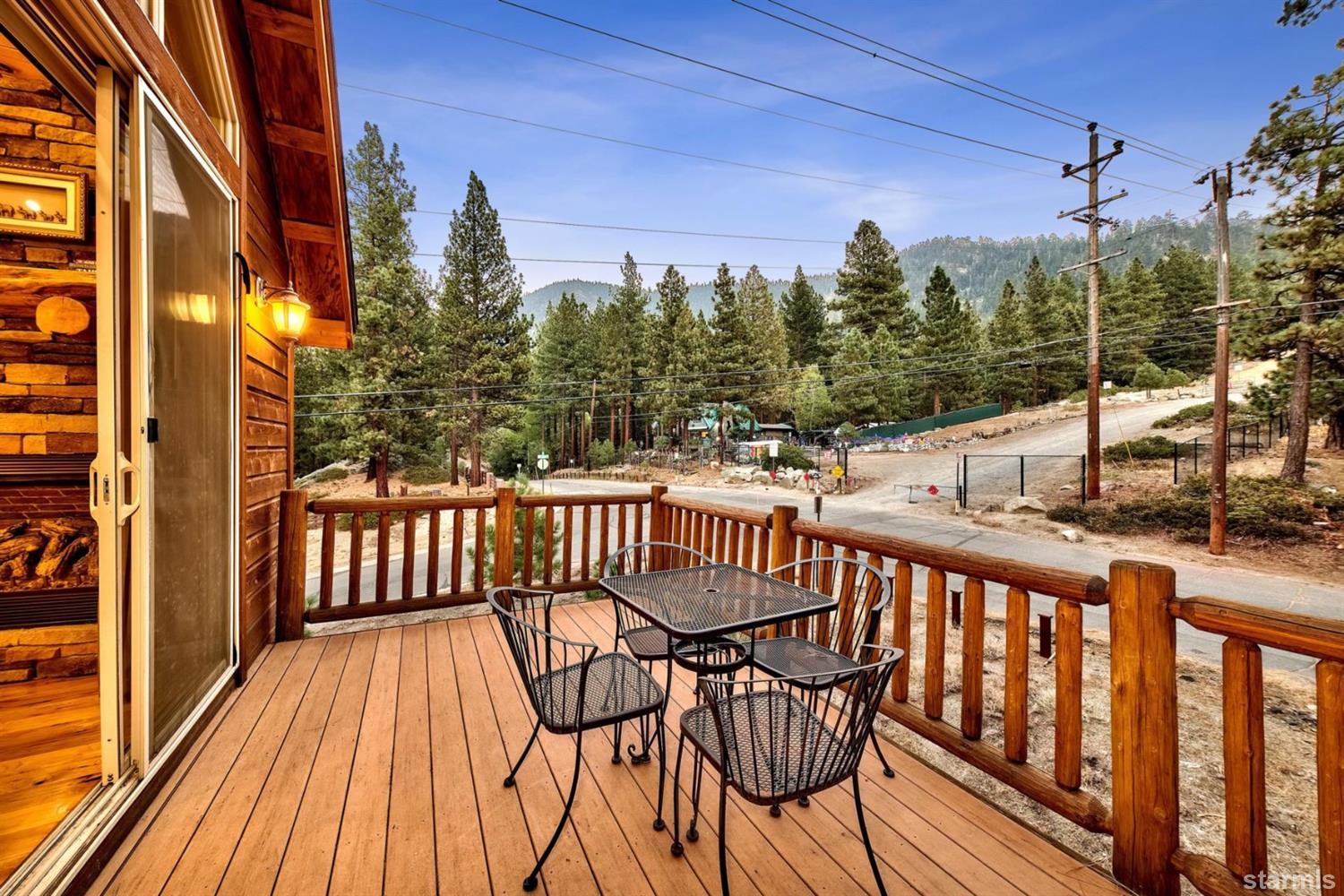 3639 Saddle Road South Lake Tahoe, CA 96150 - Photo 7 of 25 a view of a balcony with wooden floor and outdoor seating
