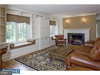 758 Harrison Road Villanova, PA 19085 - Photo 2 of 8 a living room with furniture and a fireplace