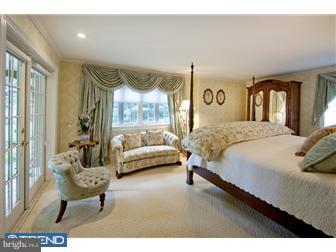758 Harrison Road Villanova, PA 19085 - Photo 3 of 8 a bedroom with a bed and a couch