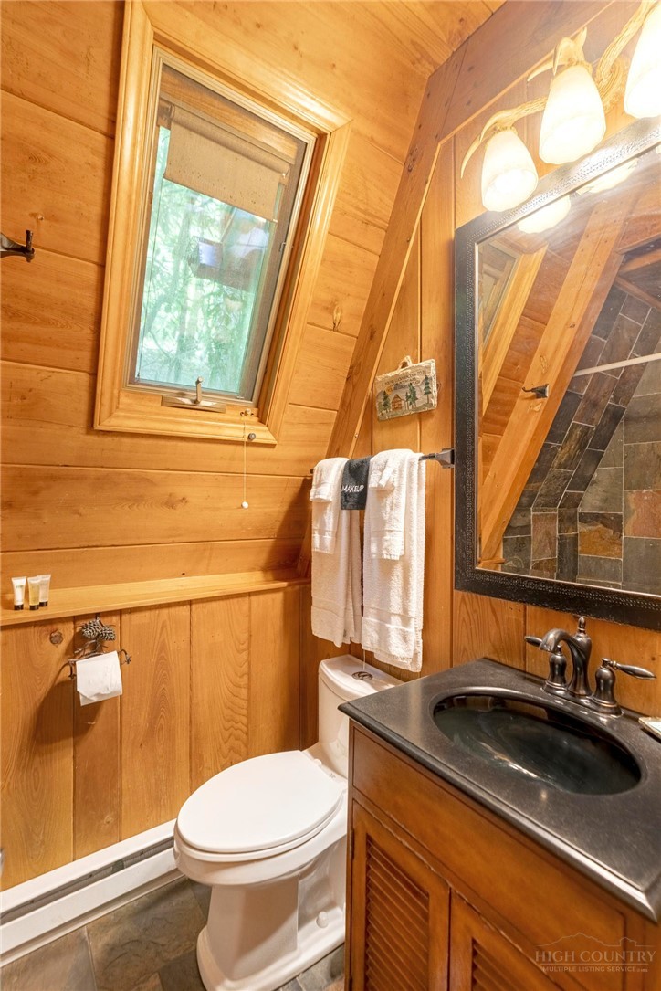 268 Cherry Drive Boone, NC 28607 - Photo 14 of 29 a bathroom with a granite countertop sink and a toilet