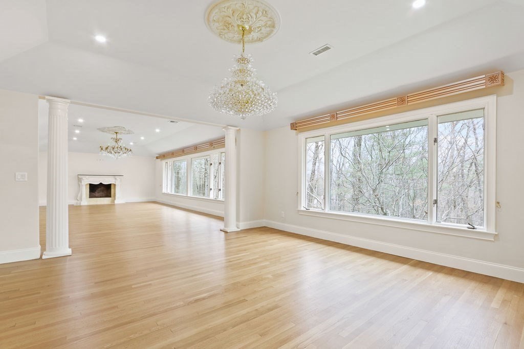80 Doublet Hill Road Weston, MA 02493 - Photo 9 of 38 a view of an empty room with wooden floor and a window