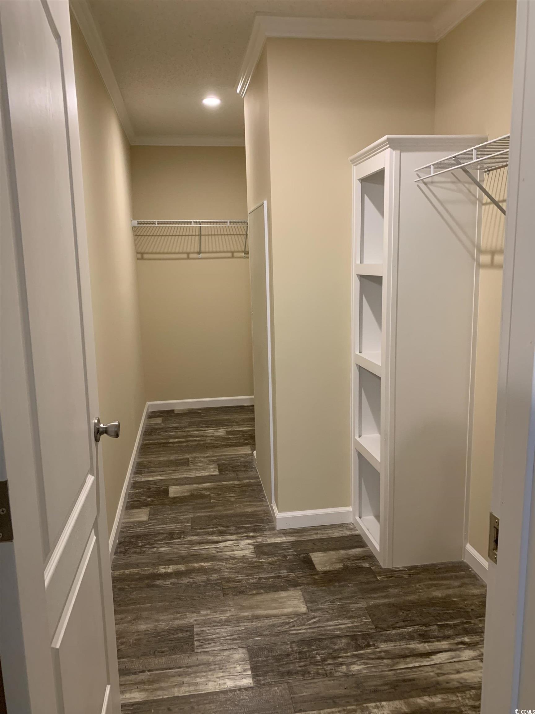 1651 Perry Circle Myrtle Beach, SC 29577 - Photo 19 of 32 Walk in closet featuring dark wood-type flooring