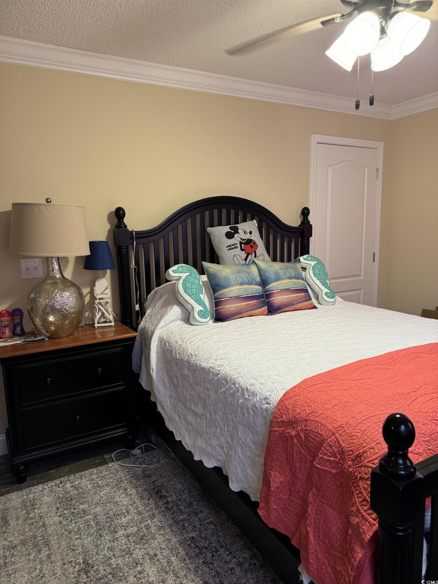 1651 Perry Circle Myrtle Beach, SC 29577 - Photo 22 of 32 Bedroom featuring crown molding, a textured ceiling, and a ceiling fan