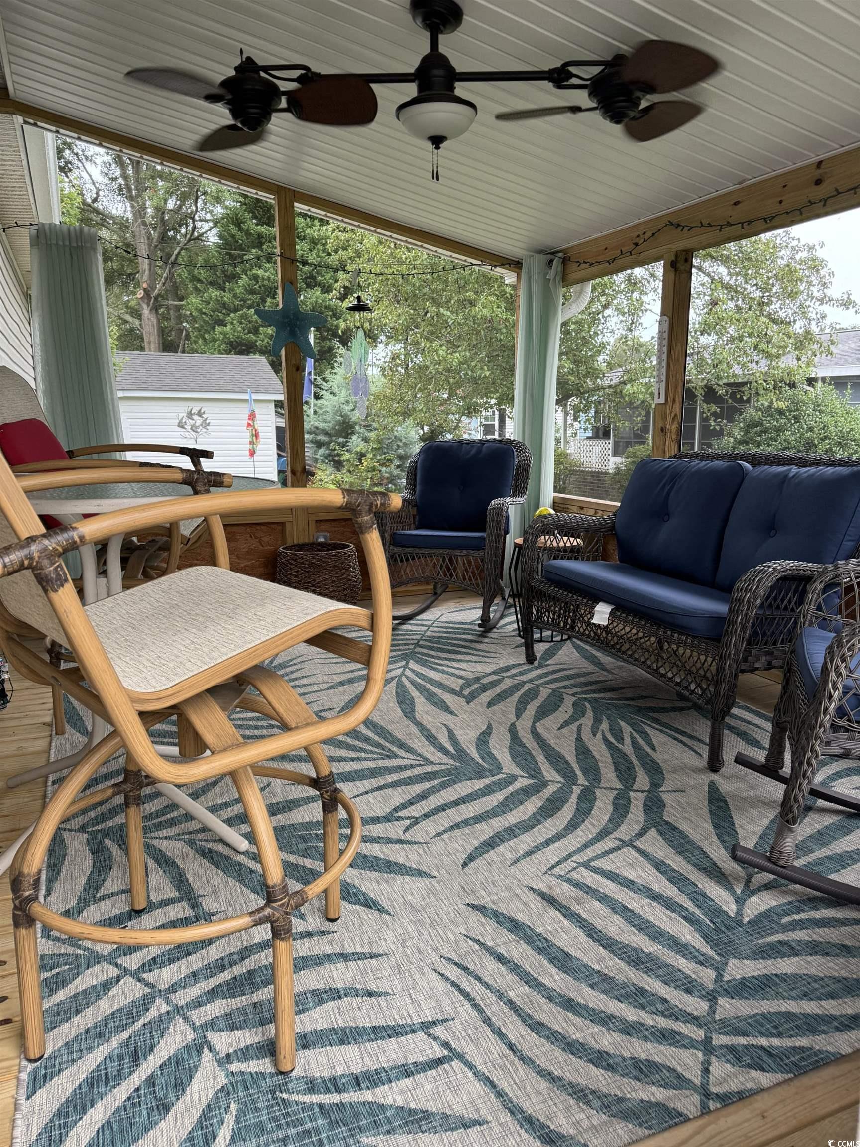 1651 Perry Circle Myrtle Beach, SC 29577 - Photo 30 of 32 View of patio with an outdoor hangout area, a sunroom, and ceiling fan