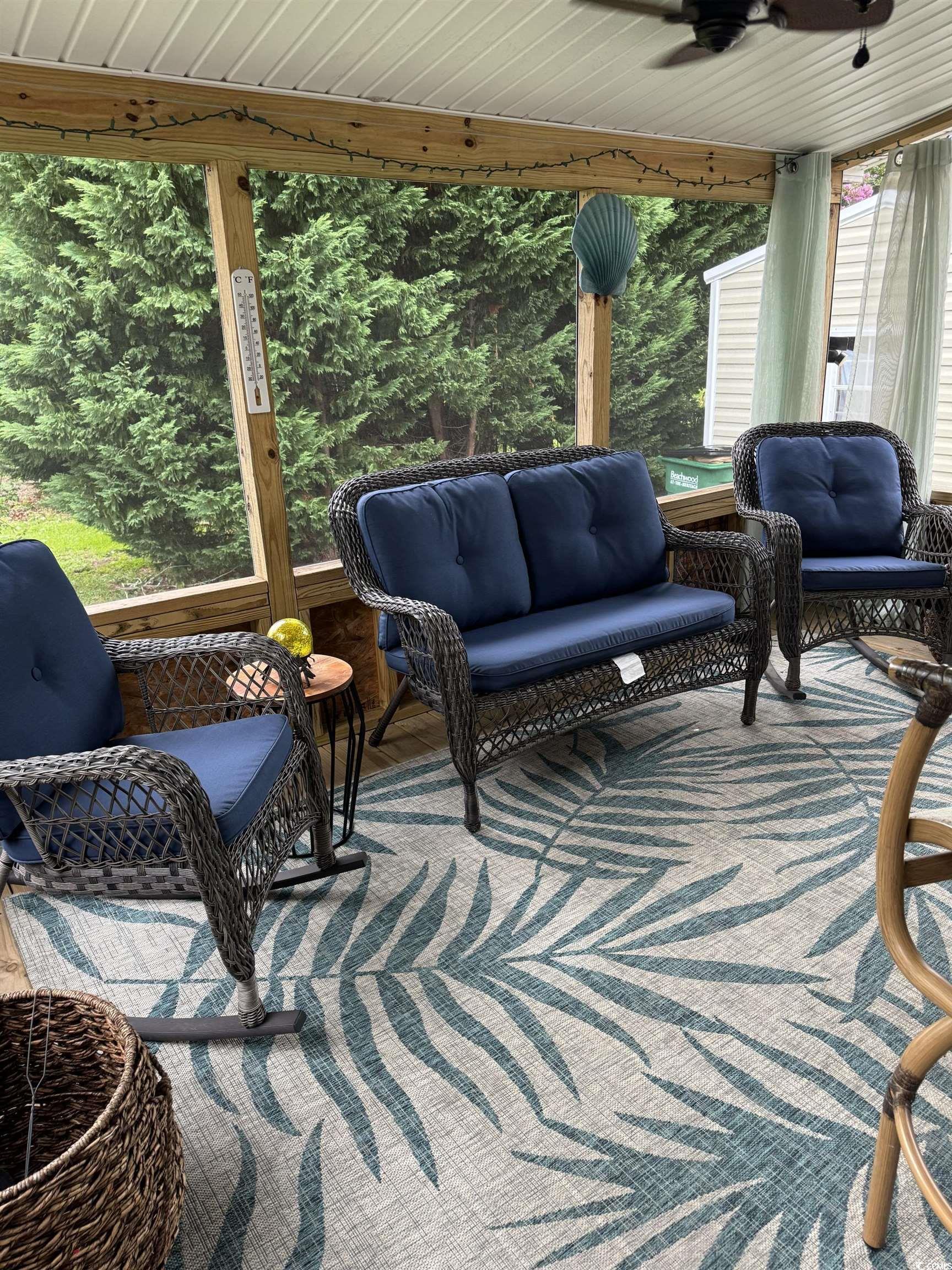 1651 Perry Circle Myrtle Beach, SC 29577 - Photo 32 of 32 View of patio / terrace featuring outdoor lounge area, ceiling fan, and a sunroom