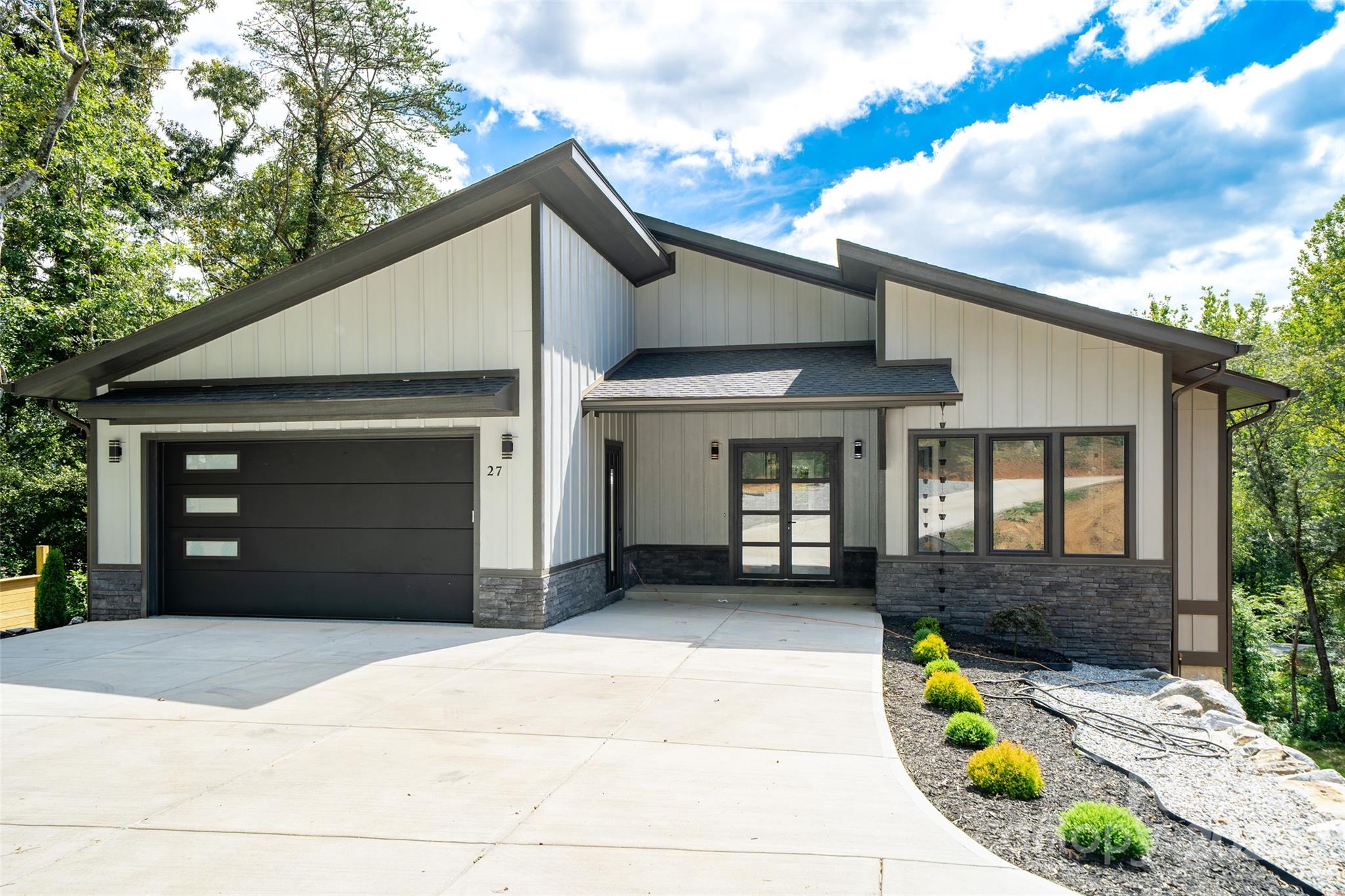 a front view of a house with garden