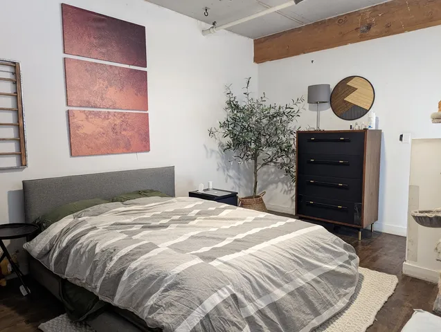 a bedroom with a bed and a cabinets