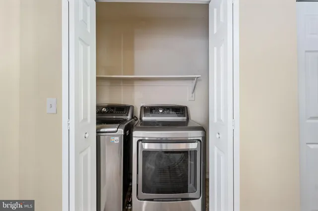 a view of an empty room with windows
