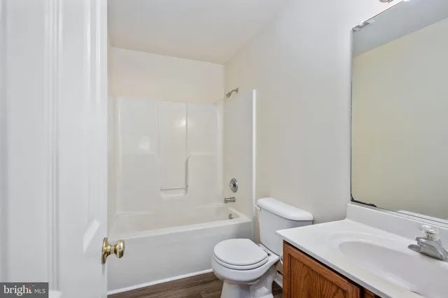 a view of a bathroom from a hallway