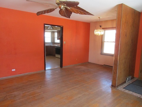 332 North Wolf Road Hillside, IL 60162 - Photo 3 of 16 an empty room with wooden floor and windows