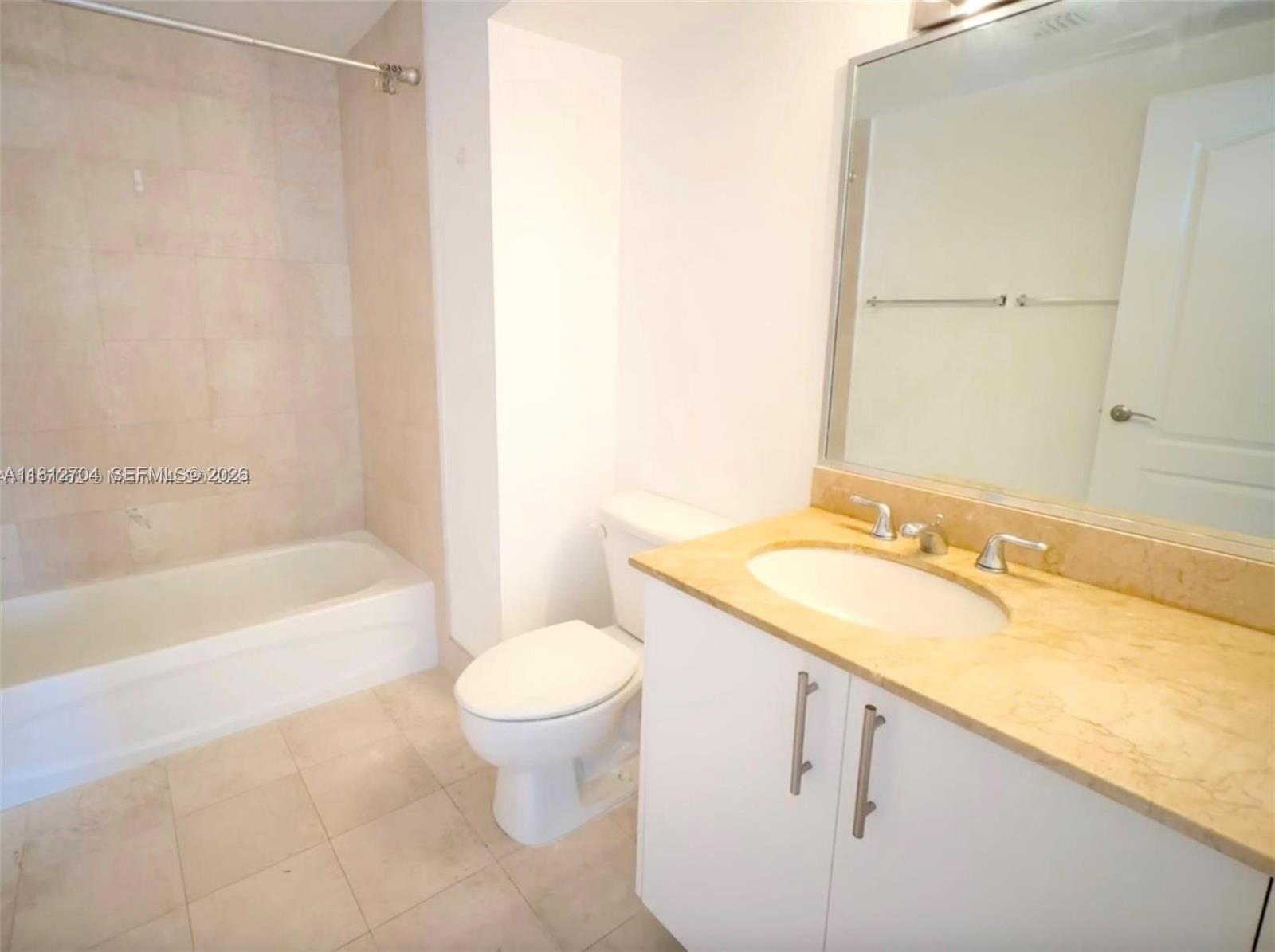 2701 Southwest 3rd Avenue, Unit 503 Miami, FL 33129 - Photo 13 of 16 a bathroom with a sink and a mirror