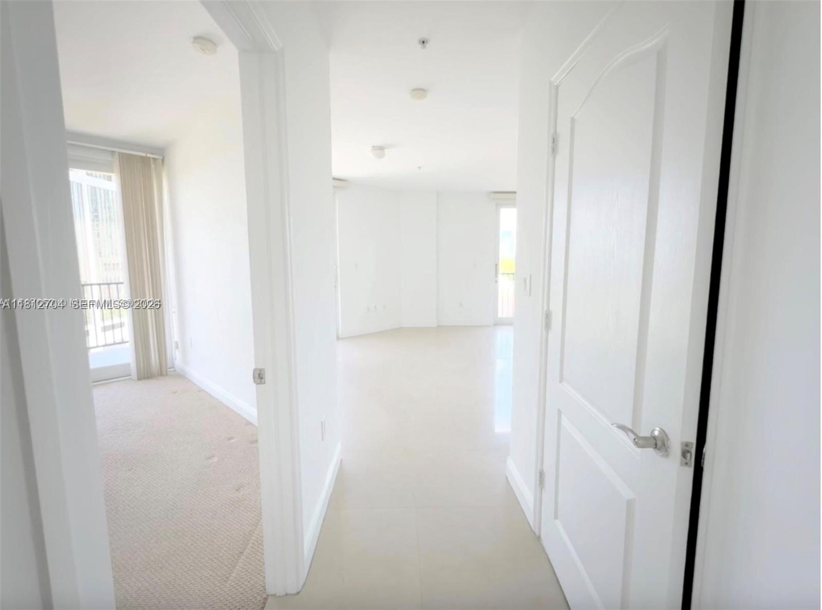 2701 Southwest 3rd Avenue, Unit 503 Miami, FL 33129 - Photo 8 of 16 a view of a hallway with a white walls