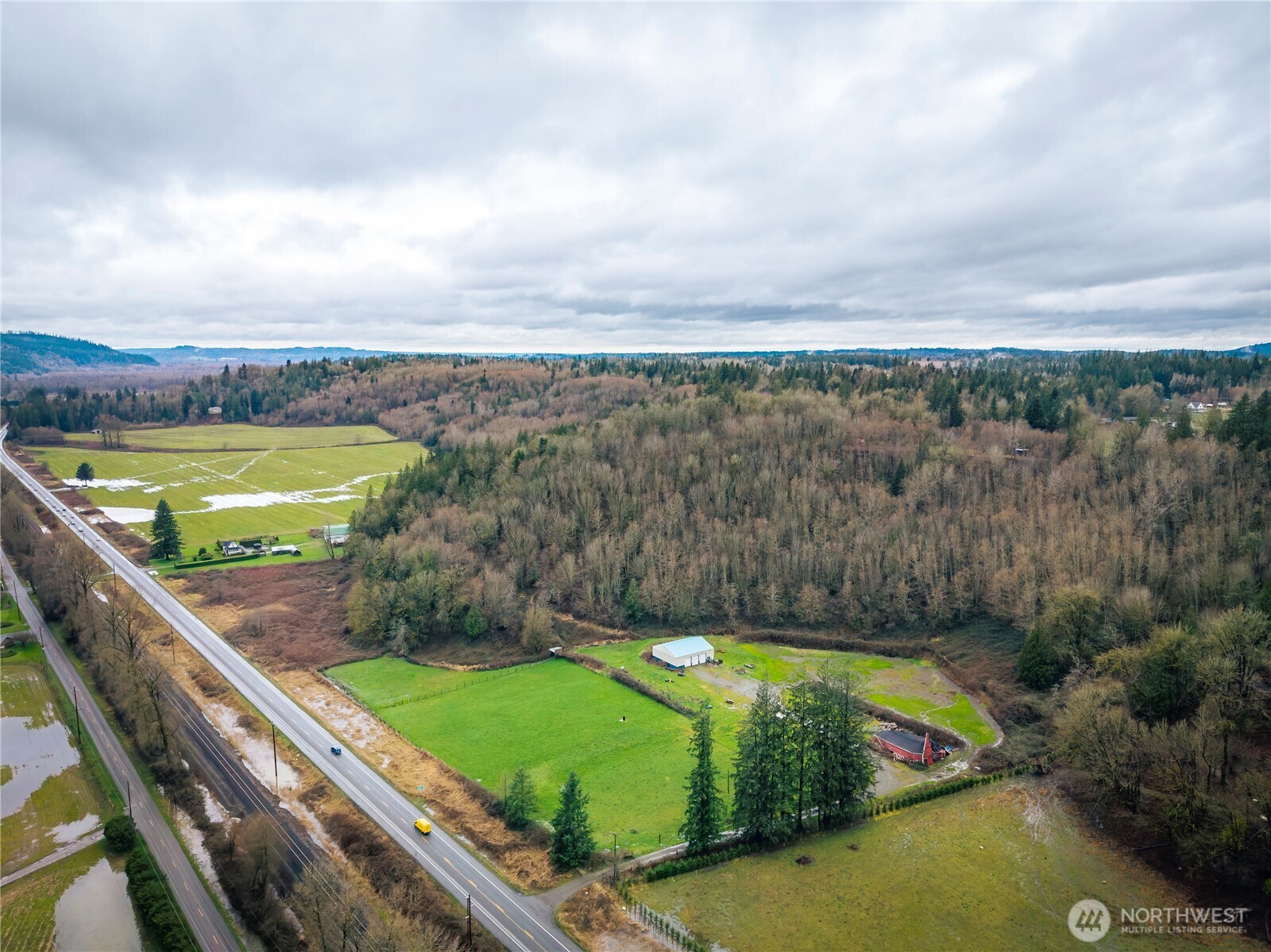 29429 Highway 2 Monroe, WA 98272 - Photo 4 of 9 a view of a swimming pool with a garden and seating area