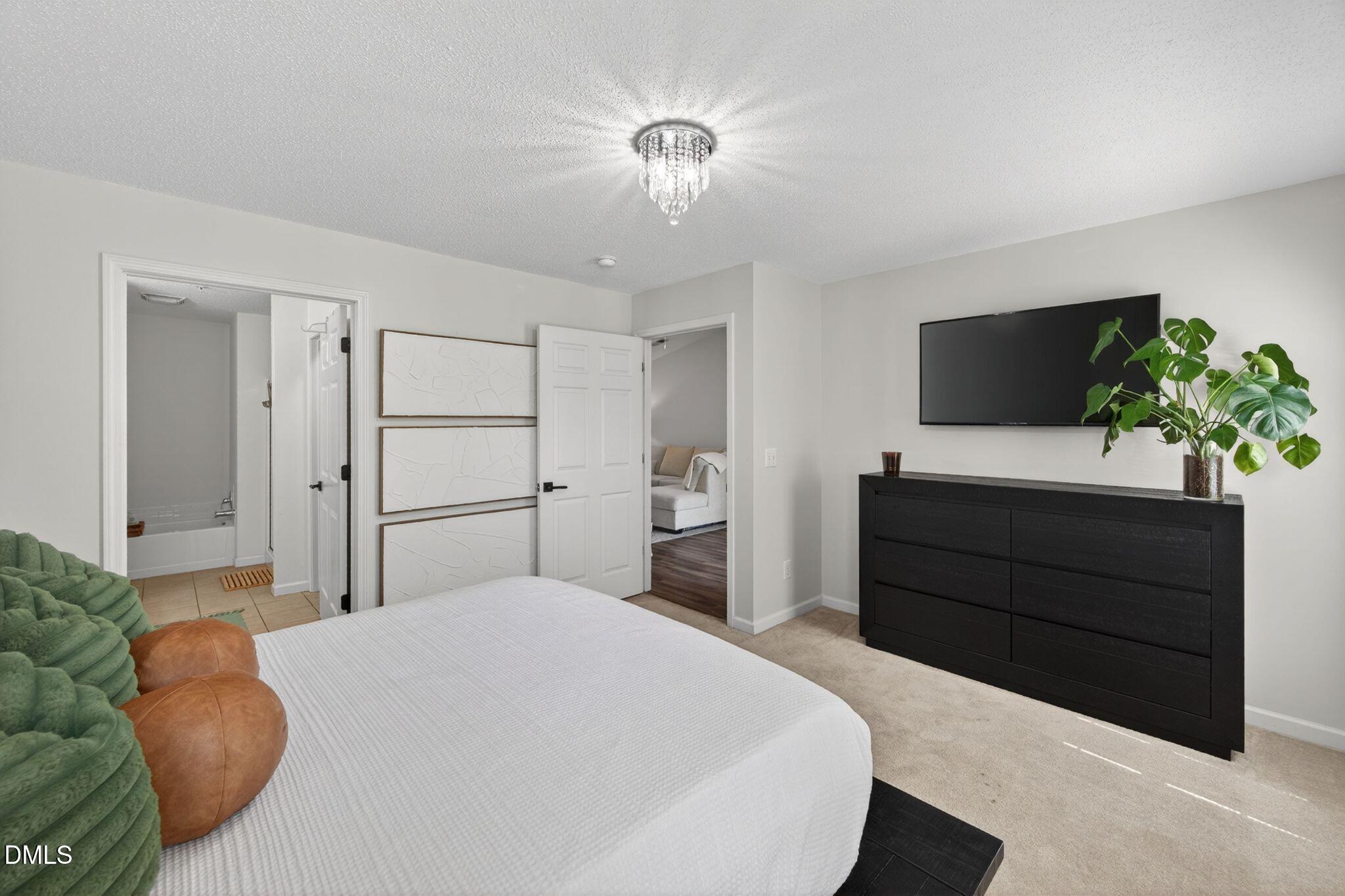 2400 Huntscroft Lane, Unit 202 Raleigh, NC 27617 - Photo 31 of 49 Primary Bedroom