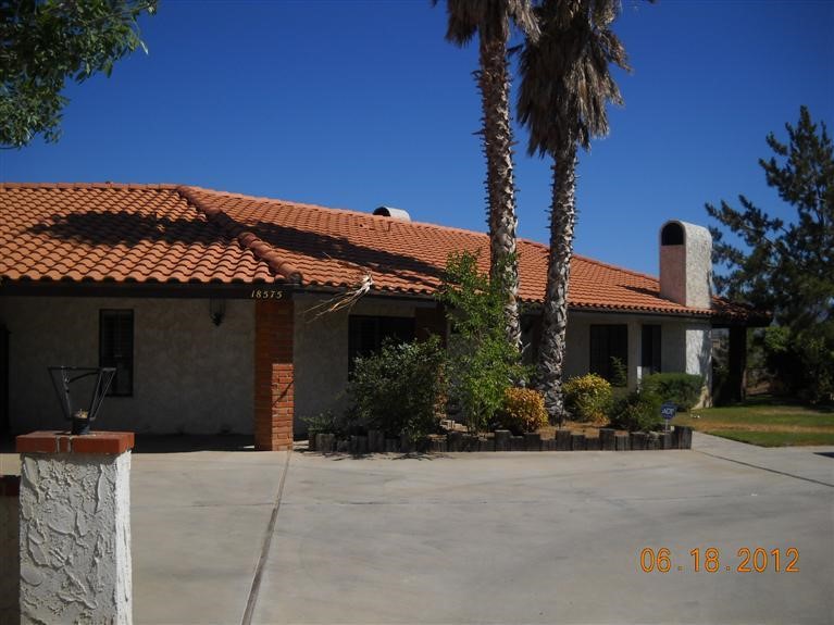 18575 Ranchero Road Hesperia, CA 92345 - Photo 1 of 1 front view of a house with a potted plant