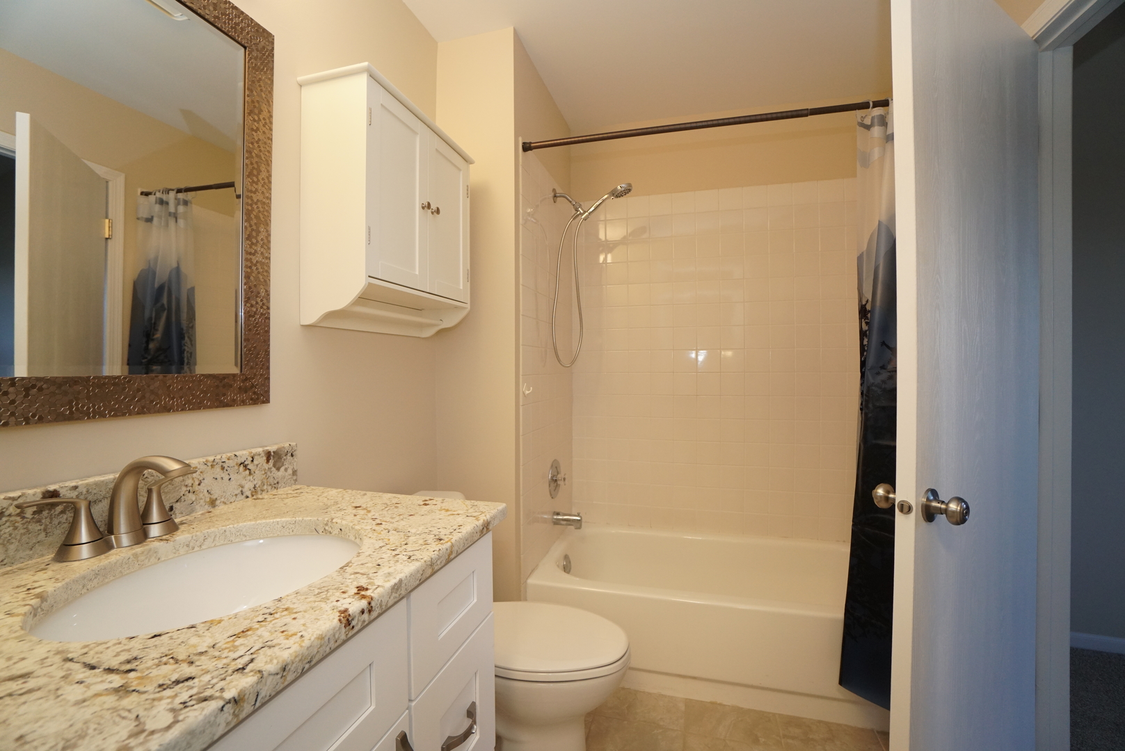 86 Bradford Lane Mundelein, IL 60060 - Photo 13 of 21 a bathroom with a granite countertop bathtub shower sink vanity and toilet