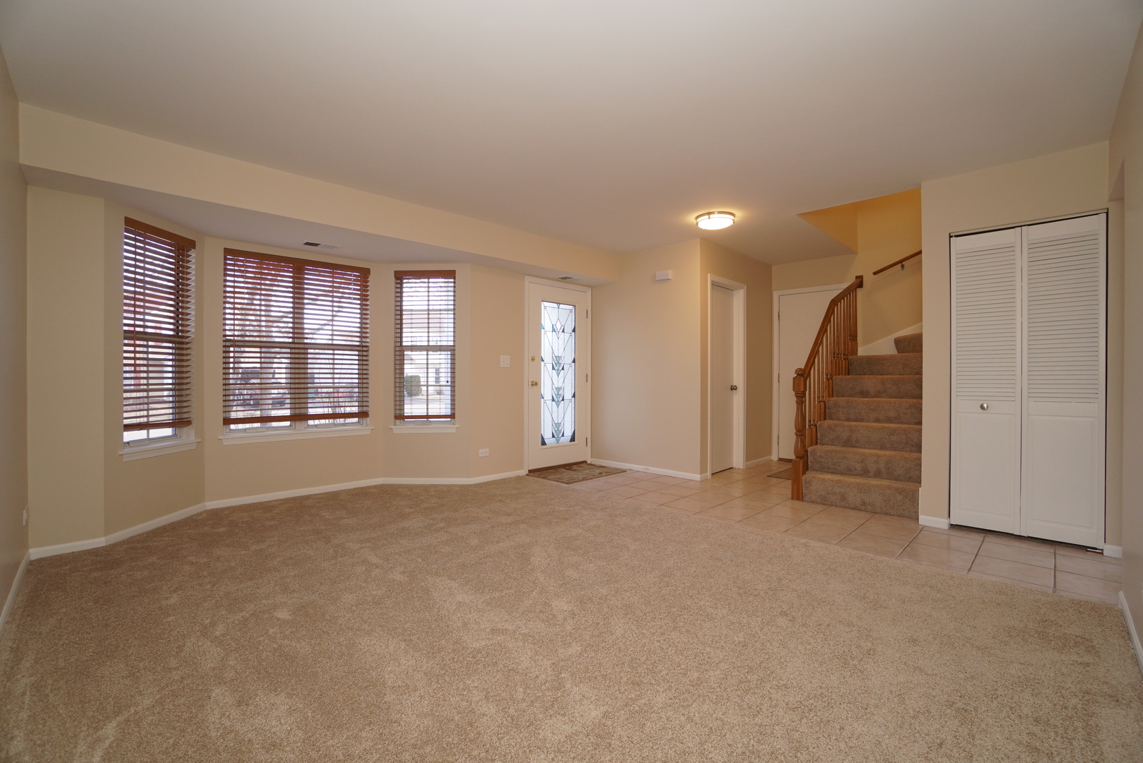 86 Bradford Lane Mundelein, IL 60060 - Photo 2 of 21 a view of an empty room with a window